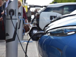 Electric vehicles charging at public fastpost charge points