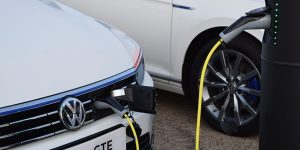 Volkswagen car charging on a public area fastpost in the centre of a town