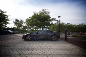 BMW i8 at Chargemaster public electric charging fastpost in a town centre