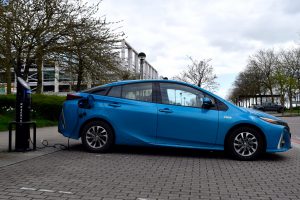 2018 Toyota Prius plug-in hybrid car charging at a fastpost in Milton Keynes