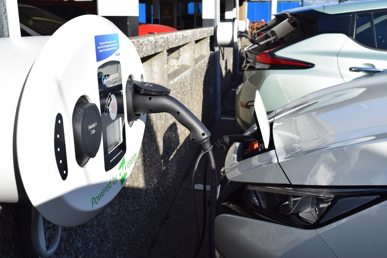 Car electric vehicle charging at public wallbox